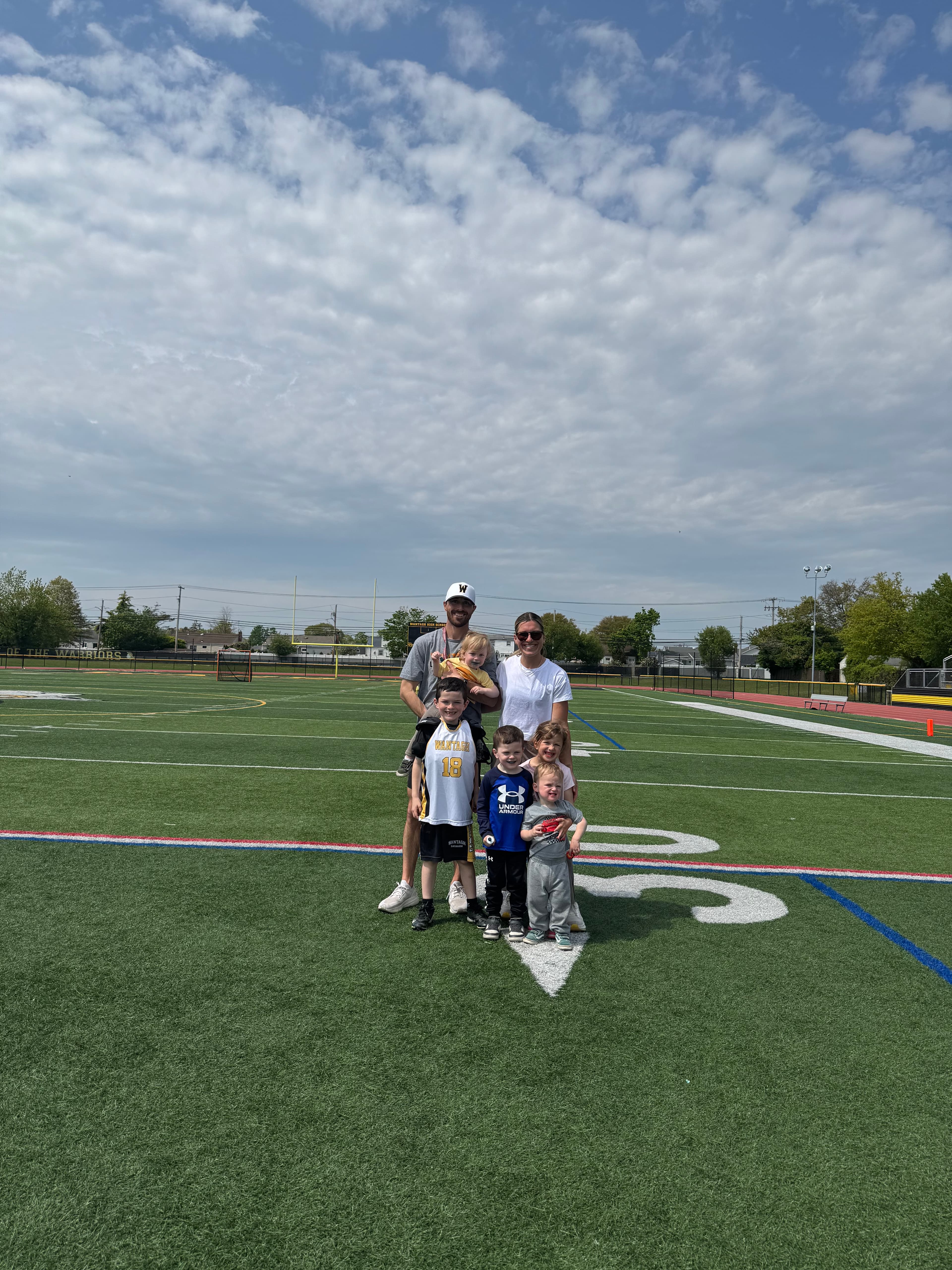 Jimmy Davis with his family after coaching a Wantagh youth lacrosse game
